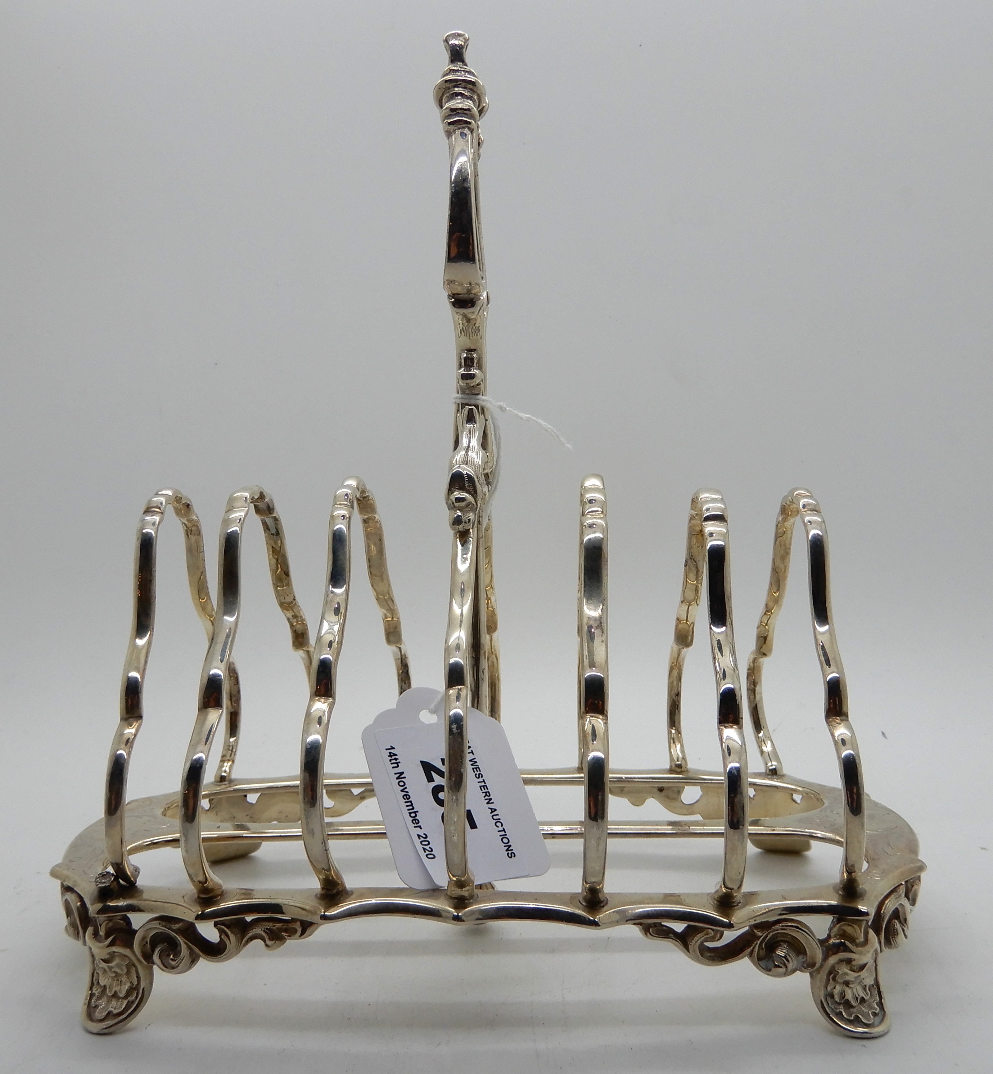 A silver toastrack, London 1866, six-section, 18.5cm long, 464gms Condition Report: Available upon