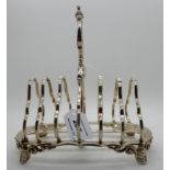 A silver toastrack, London 1866, six-section, 18.5cm long, 464gms Condition Report: Available upon