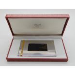 A Must De Cartier white metal and gilt card case stamped Cartier, in original box, 9.8cm x 6cm