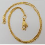 An Arabic 21k gold hand pendant length 2.4cm, and rope chain length 49cm, weight 5.8gms Condition