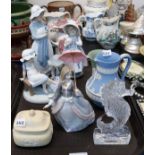 A collection of Nao and Lladro figures, a Waterford crystal seahorse and three pieces of Wedgwood