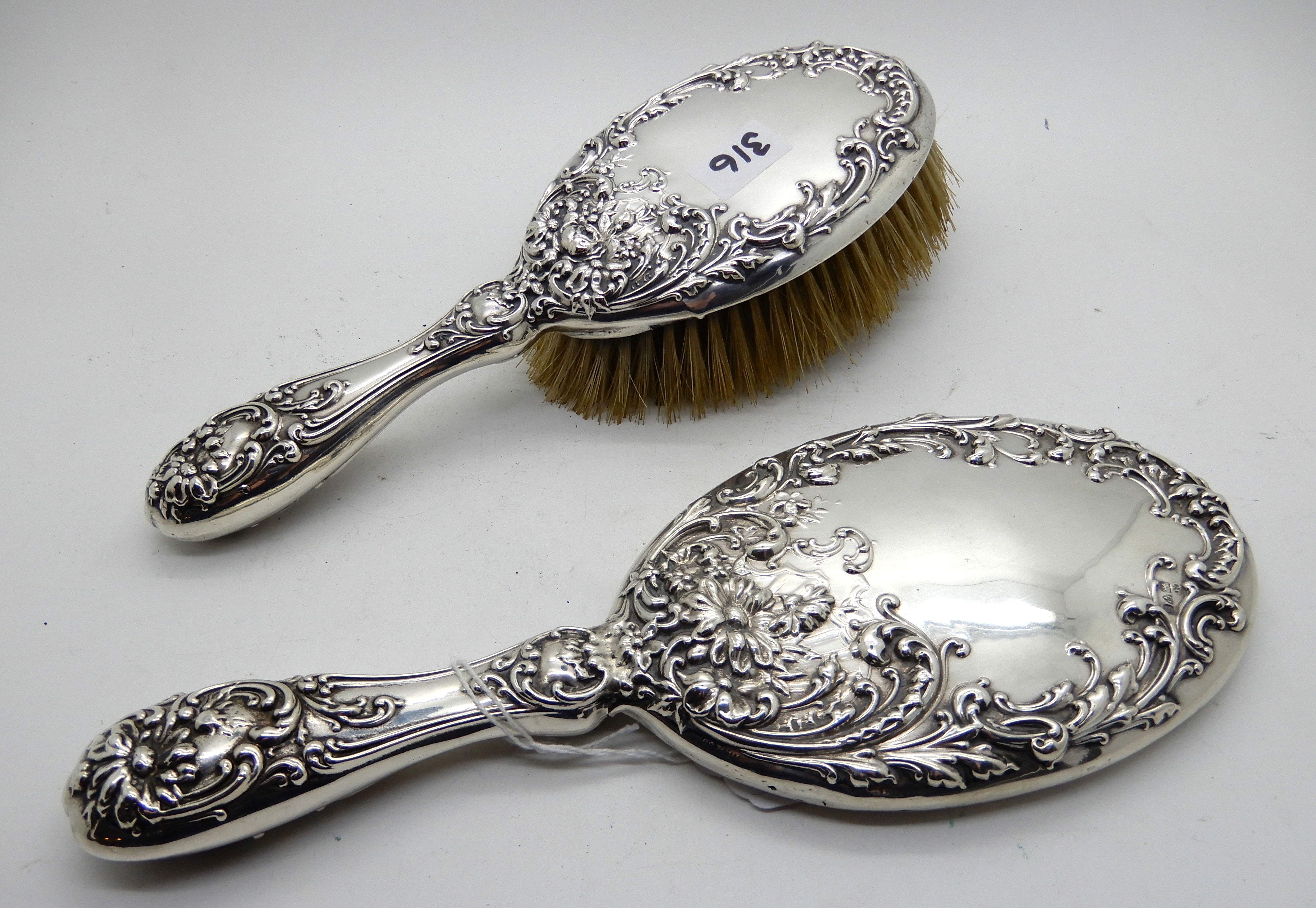 A silver backed brush and mirror set, Chester 1902 Condition Report: Available upon request