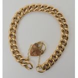 A 9ct gold curb link bracelet with a heart shaped clasp, length approx 19.5cm, weight 20gms