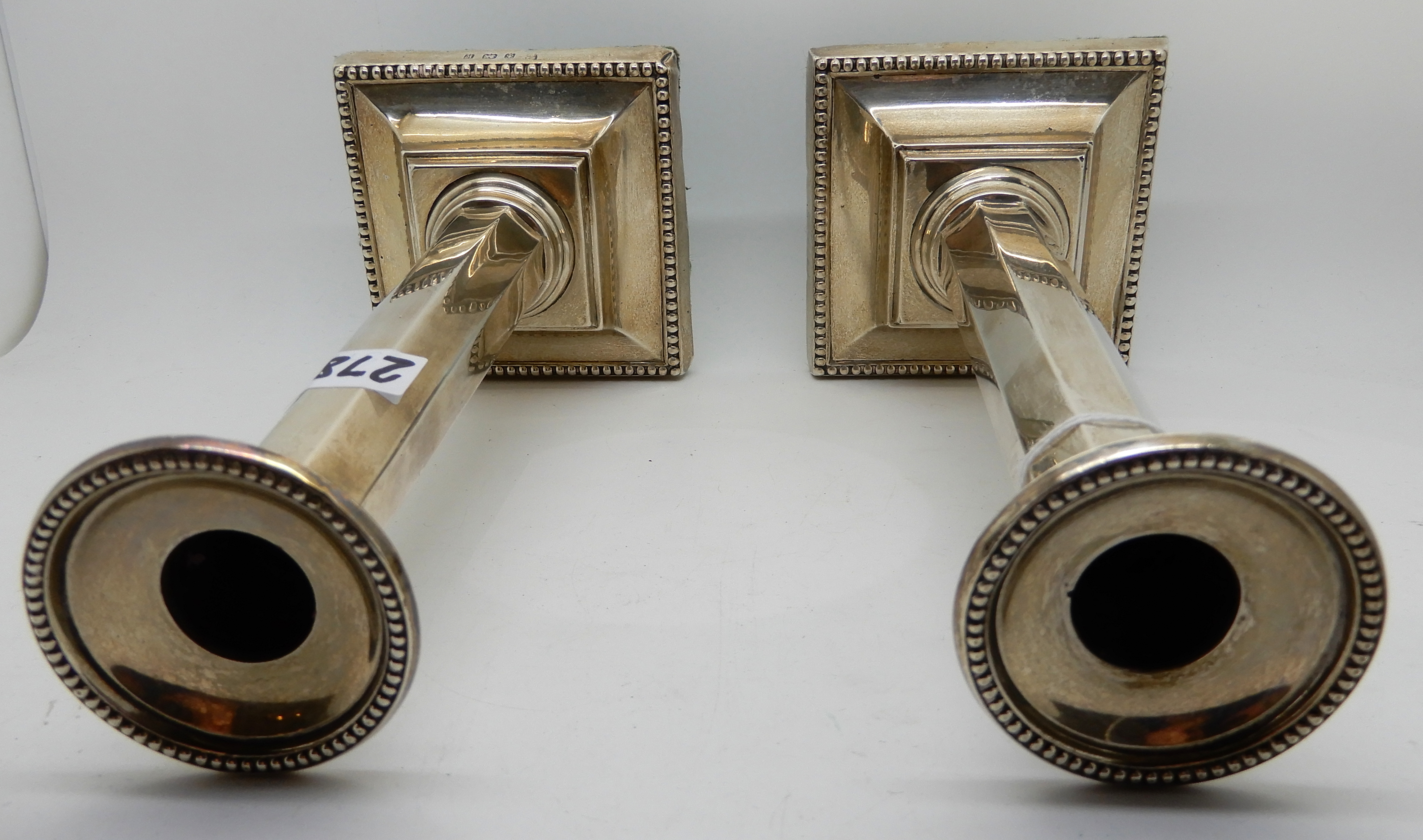 A pair of silver candlesticks, Birmingham 1909, the removable drip pans on tapering octagonal - Image 4 of 4