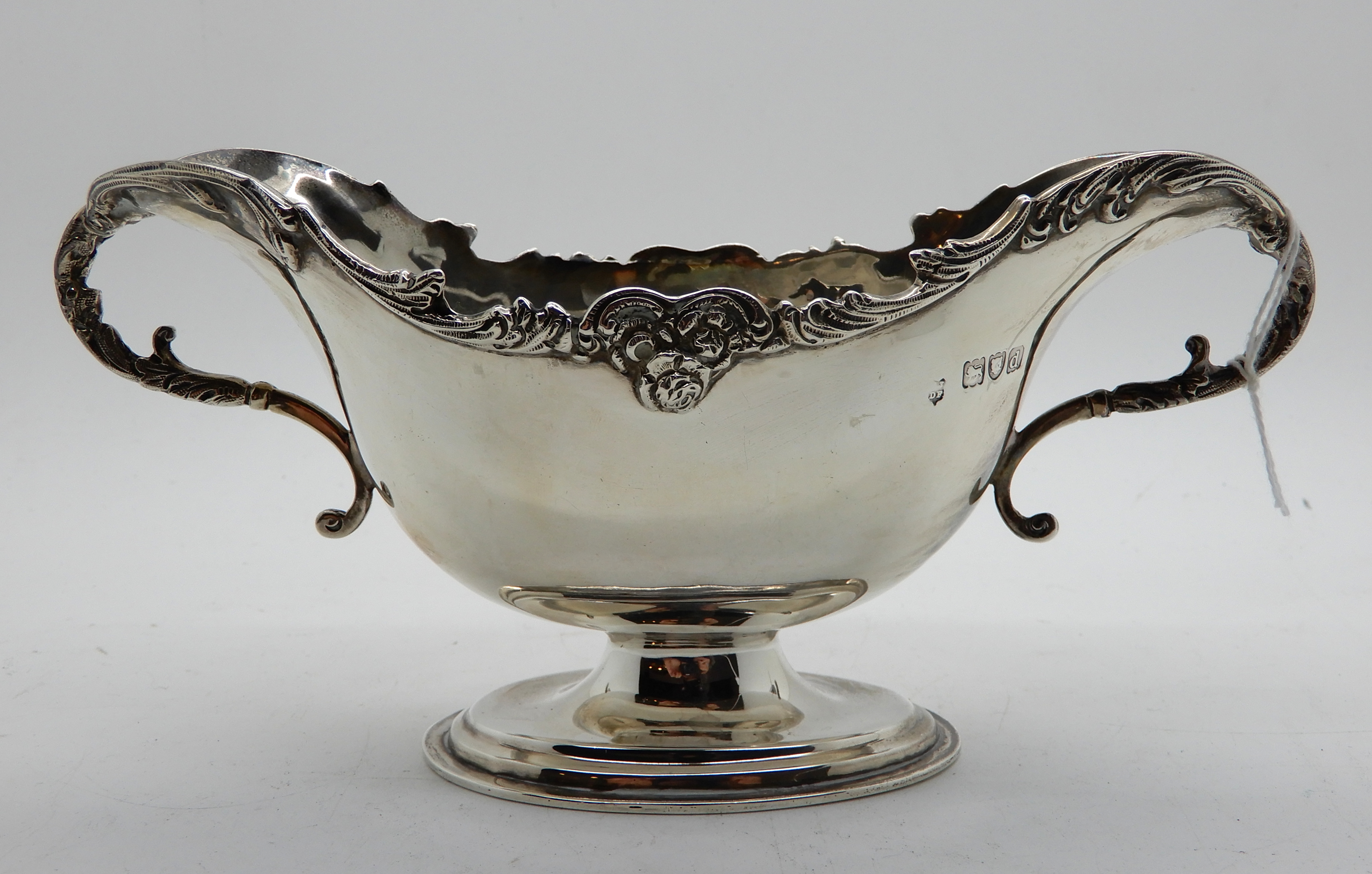 A silver doubled ended sauceboat, London 1899, 18cm across the handles, 169gms Condition Report: