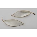 A pair of silver and white enamel leaf brooches by David Andersen Condition Report: Not available