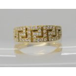 An 18ct gold Greek key pattern ring set with diamonds, ring size O1/2, weight 5.6gms(Matching item