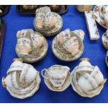 A Langton china teaset decorated with flowers, together with a Foley china teaset decorated with