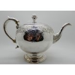 A silver teapot, Edinburgh 1804, of globular form with engraved decoration, 17cm high, 600gms