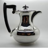 A silver hot water pot, Sheffield 1932, 21.5cm high, 713gms Condition Report: Available upon
