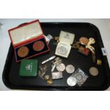 A tray lot including coins, commemorative medallions etc Condition Report: Available upon request