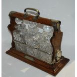 A oak cased and white-metal mounted three bottle Tantalus with key, 40cm wide Condition Report: