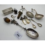 A lot comprising assorted white metal items - part baby rattle, sifter spoon, snuff box, fancy
