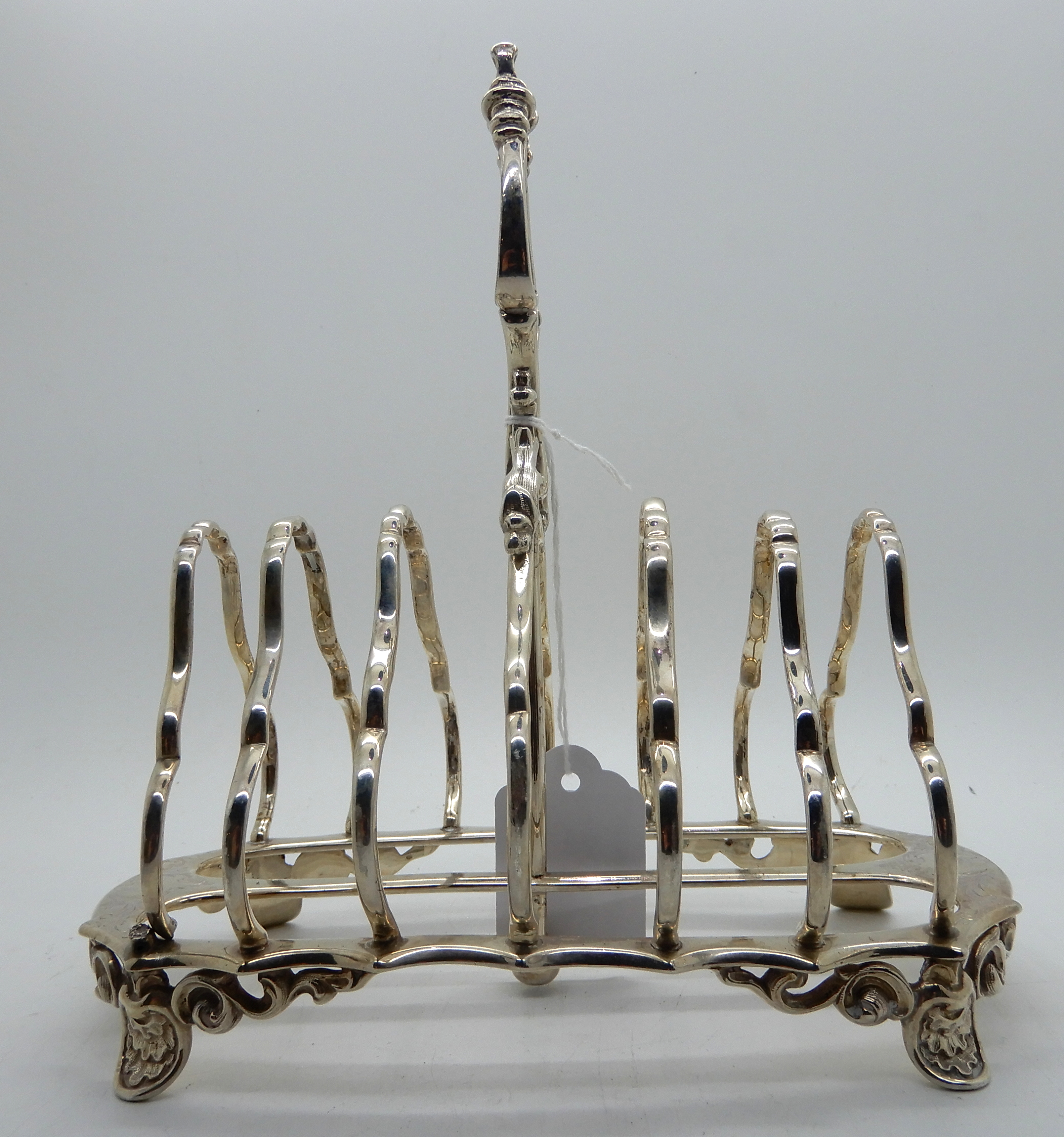 A silver toastrack, London 1866, six-section, 18.5cm long, 464gms Condition Report: Available upon - Image 2 of 3