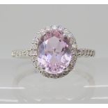 A 9ct white gold kunzite and diamond cluster ring, size N1/2, weight 2.3gms Condition Report: