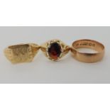 A 9ct gents signet ring size R1/2, a 9ct garnet set ring Size L1/2 and a 9ct rose gold wedding