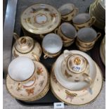 A Japanese eggshell tea set featuring moth and butterfly decoration Condition Report: Not