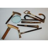 Seven various gold-tipped walking cane handles and a silver example Condition Report: Available upon