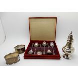 A lot comprising a cased set of six silver coffee spoons, Sheffield 1946, a pepper pot and a pair of