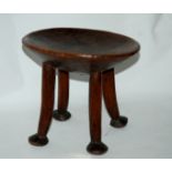 A carved tribal stool and other tribal figures Condition Report: Available upon request
