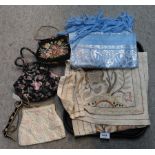 An assortment of embroidered ladies clutch bags, a blue and silver embroidered shawl and other items