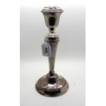 A silver candlestick, Birmingham 1961, 26.5cm high, weighted Condition Report: Available upon