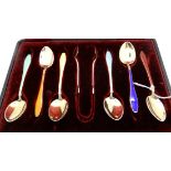 A cased set of six sterling silver and enamel coffee spoons with tongs Condition Report: Available