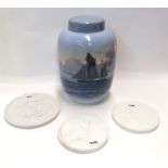 A Royal Copenhagen jar and cover, together with three Eneret classical plaques and a Delft charger