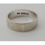 An 18ct white gold bark textured wedding ring size Q, weight 6.1gms Condition Report: Available upon