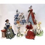 Three Royal Doulton figures including Catherine of Aragon, Anne Boleyn, and Catherine Parr, two