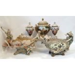 An Austrian porcelain centrepiece decorated with a maiden and cherub, a Turn Wien example, a urn and