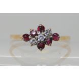 A 9ct gold ruby and diamond cluster ring, size W1/2, weight 1.9gms Condition Report: Available