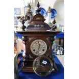 A wooden mantle clock with Jungens movement Condition Report: Available upon request