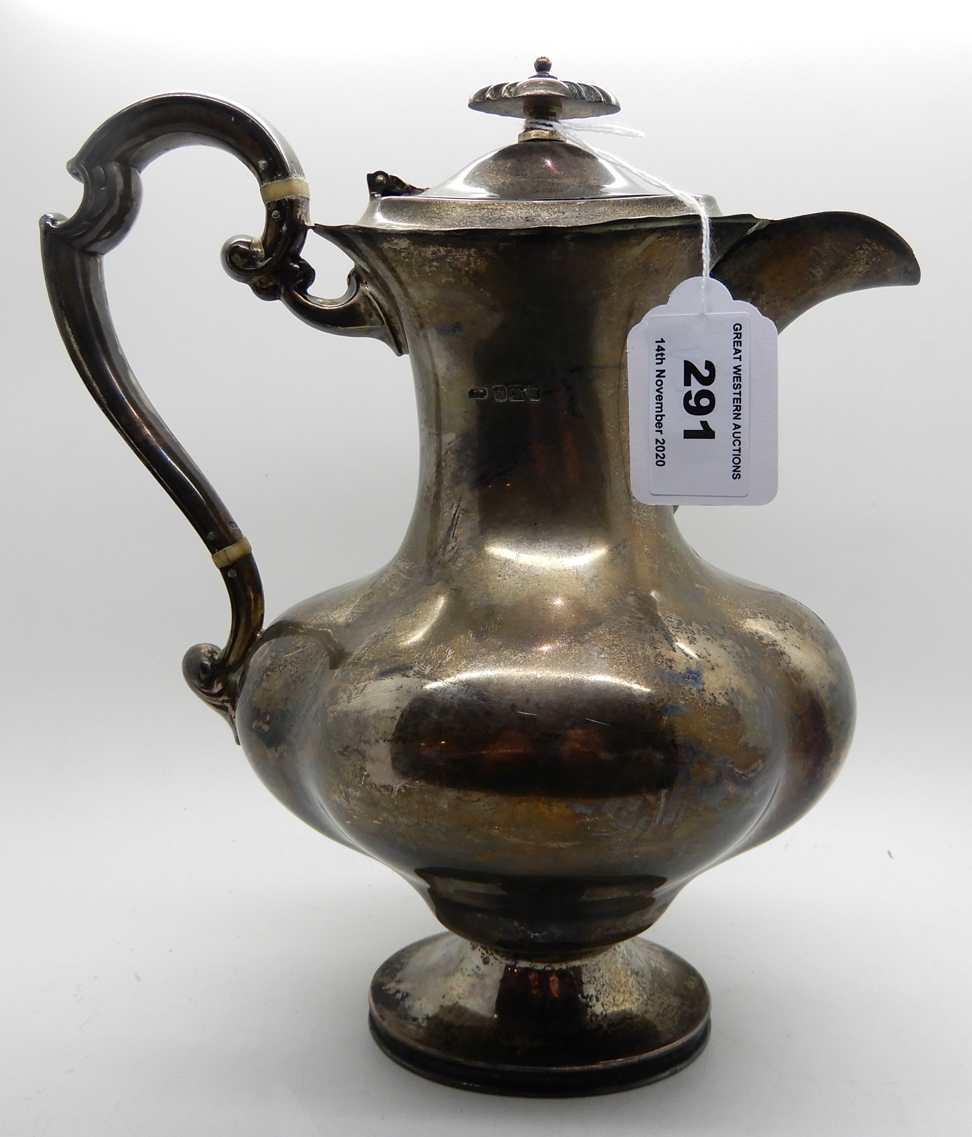 A silver hot water pot, Sheffield 1909, 24cm high, 636gms Condition Report: Available upon request