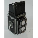 A Rolleiflex camera twin lens camera, a Rolleicord camera and Reflex-Korelle camera in case