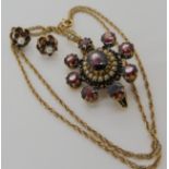 A yellow metal Edwardian pearl and garnet pendant, length with bail 3.9cm, with 9ct rope chain and