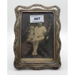A silver mounted photo frame, Birmingham 1907, of rectangular form, 18cm x 13cm, apperture 13.5cm