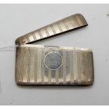 A silver card case, Chester 1924, of rectangular form with engine turned decoration and lank