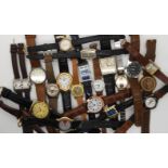 A collection of watches to include a Dali shaped watch, a USA five cent coin watch and a Iguzzini