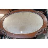 A wrought iron standard lamp and a mirror (2) Condition Report: Available upon request