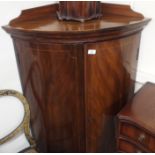 A mahogany bow front corner cabinet, 124cm high x 80cm wide Condition Report: Available upon