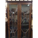 A mahogany bookcase with two glazed doors, 187cm high x 97cm wide Condition Report: Available upon