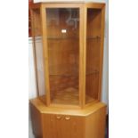 A Turnidge of London teak corner display cabinet, 172cm high x 95cm wide Condition Report: Available