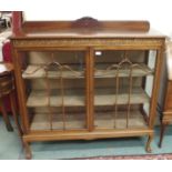 A mahogany display cabinet on ball and claw feet, 124cm high x 122cm wide Condition Report: