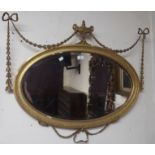 An oval gilt wall mirror,walnut mirror, circular mirror and an inlaid oval mirror (4) Condition