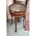 A copper bound oak planter, 79cm high x 46cm diameter Condition Report: Available upon request