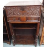 A carved oak bible box on latter stand Condition Report: Available upon request