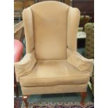 A modern wingback armchair Condition Report: Available upon request