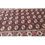 A dark ground Turkeman rug, 309cm x 190cm Condition Report: Available upon request