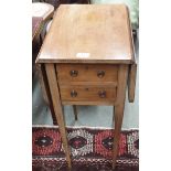 A small mahogany two drawer table with drop flaps Condition Report: Available upon request